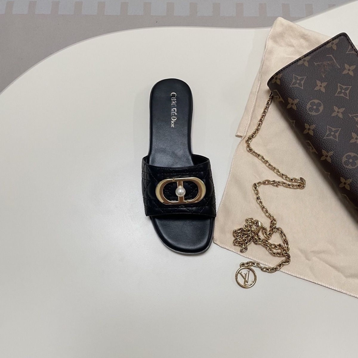 Quilted Leather Slide Sandals with Metal Buckle and Pearl Detail