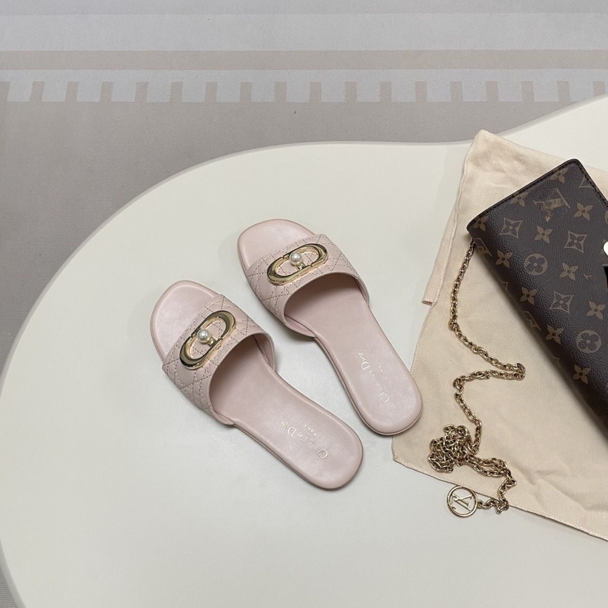 Quilted Leather Slide Sandals with Metal Buckle and Pearl Detail